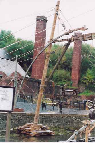 Timber rane lifting iron from a barge